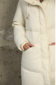 Long women's milk-colored down jacket with natural filler