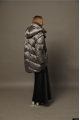 Long women's down jacket in dark metallic color with natural filler