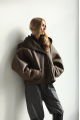 Short sheepskin coat with a chocolate-colored hood made of natural sheepskin