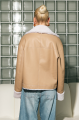 Double-sided short sheepskin coat made of natural sheepskin in beige color