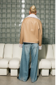 Double-sided short sheepskin coat made of natural sheepskin in beige color