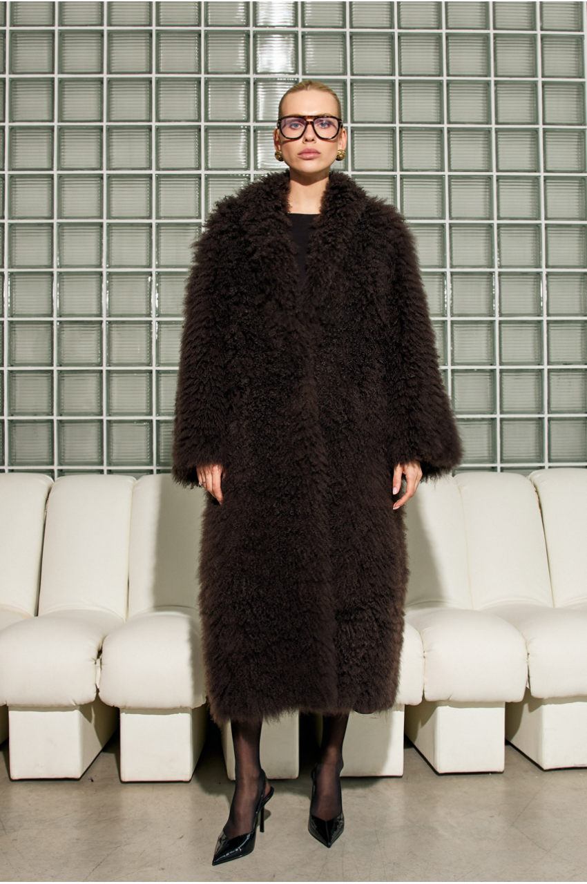 Long women's chocolate-colored fur coat made of cashmere goat