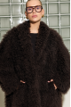 Long women's chocolate-colored fur coat made of cashmere goat