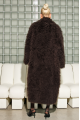 Long women's chocolate-colored fur coat made of cashmere goat
