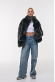 Short double-sided sheepskin coat in gray color made of cashmere lamb
