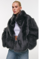 Short double-sided sheepskin coat in gray color made of cashmere lamb