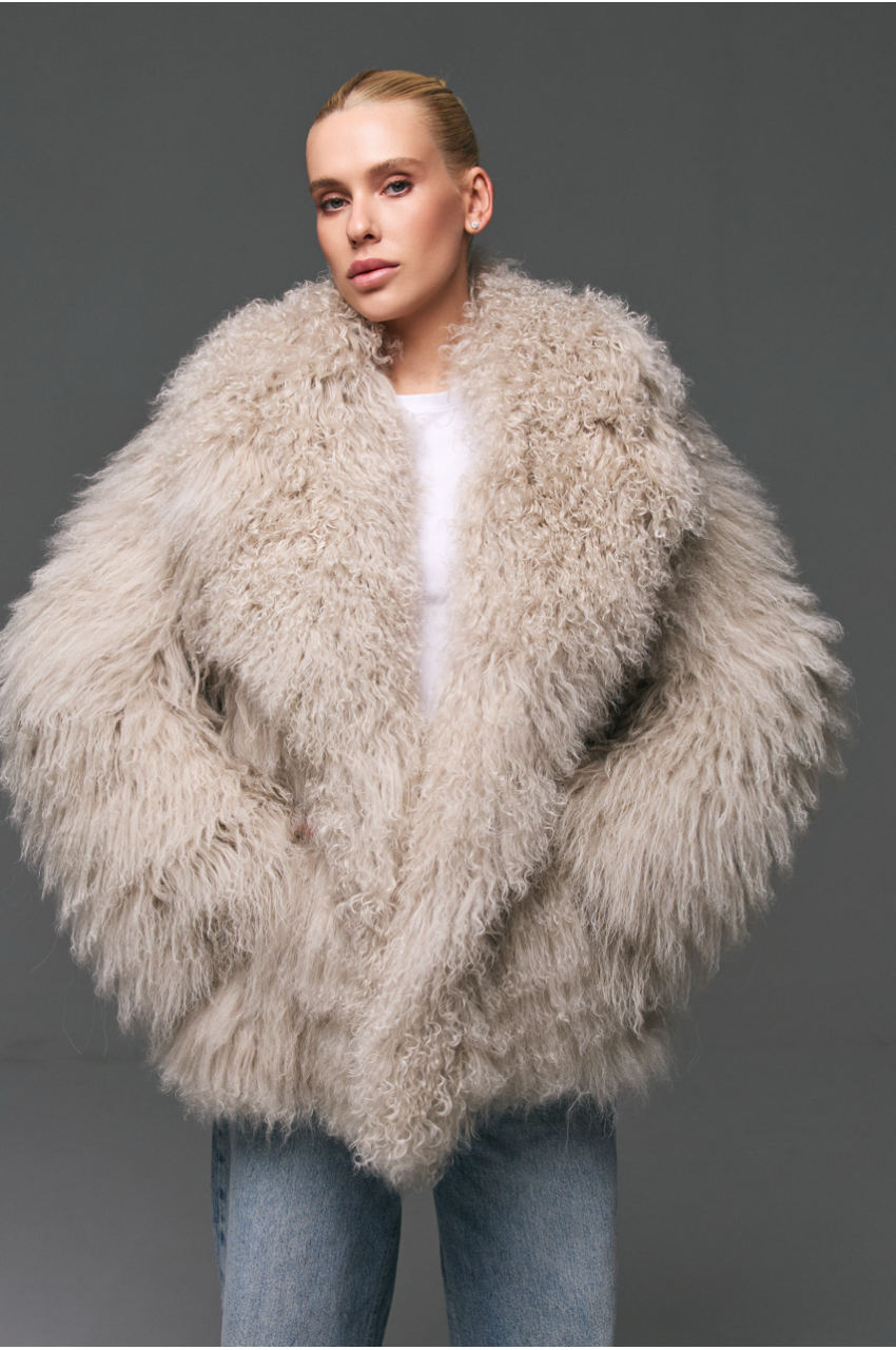 Stylish fur coat made of natural llama in beige color