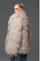 Stylish fur coat made of natural llama in beige color