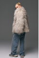 Stylish fur coat made of natural llama in beige color
