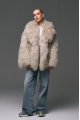Stylish fur coat made of natural llama in beige color