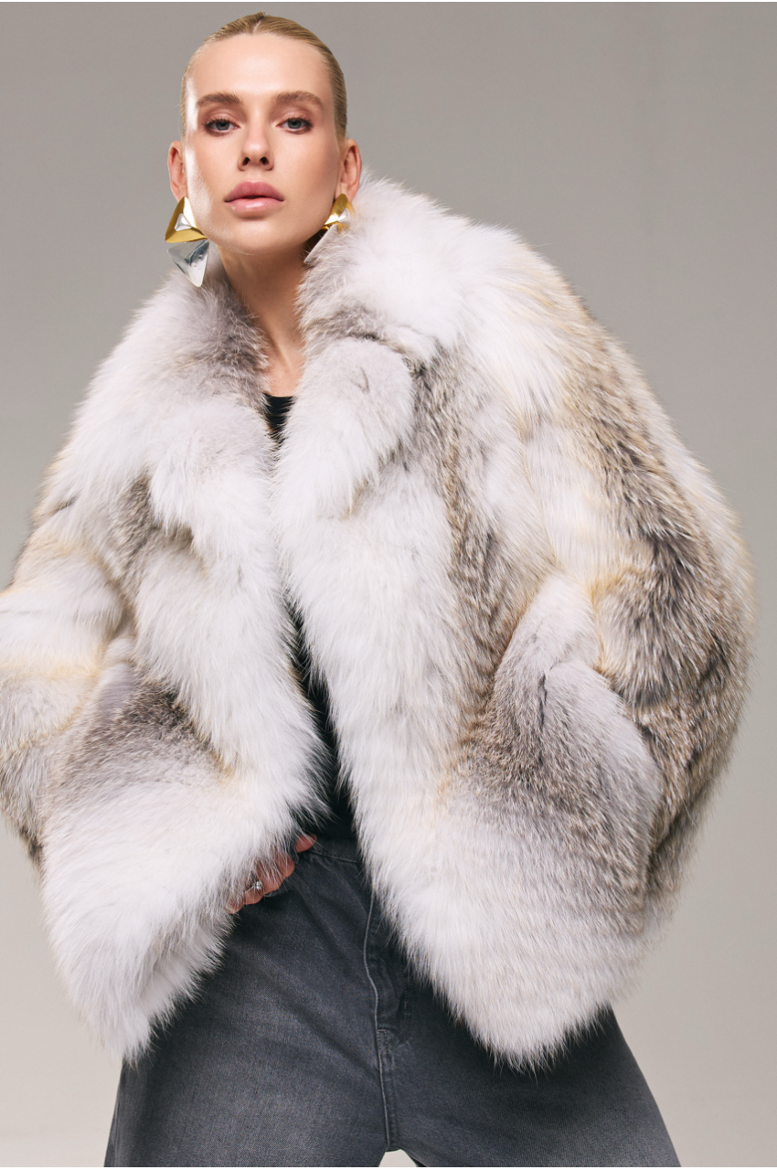 Stylish women's white fox fur coat with brown highlights