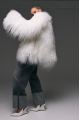 Stylish fur coat made of natural white llama