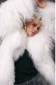Stylish fur coat made of natural white llama