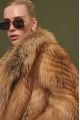 Stylish women's brown fox fur coat
