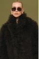 Women's fur coat made of natural cashmere goatskin in dark chocolate color