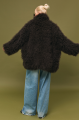 Women's fur coat made of natural cashmere goatskin in dark chocolate color