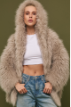Women's fur coat made of natural cashmere goatskin in beige color