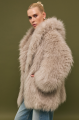 Women's fur coat made of natural cashmere goatskin in beige color