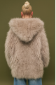 Women's fur coat made of natural cashmere goatskin in beige color