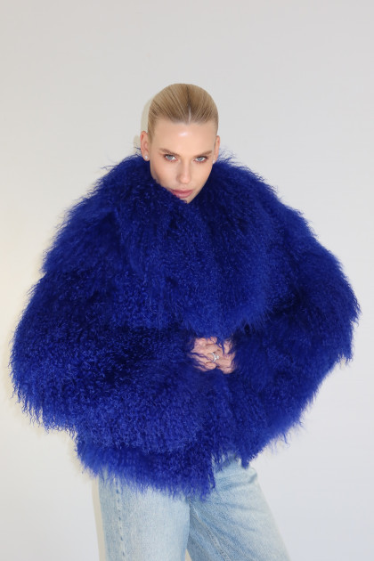Stylish fur coat made of natural llama in blue