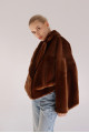 Reversible short copper-colored sheepskin bomber jacket