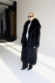Long women's black fox fur coat