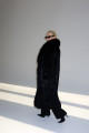 Long women's black fox fur coat