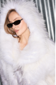 White raccoon fur coat with gray trim and hood