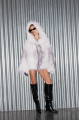 White raccoon fur coat with gray trim and hood
