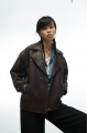 Stylish jacket made of natural leather in dark chocolate color