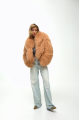 Caramel-colored women's sheepskin coat made of natural llama