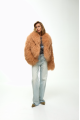 Caramel-colored women's sheepskin coat made of natural llama