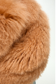 Caramel-colored women's sheepskin coat made of natural llama