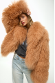 Caramel-colored women's sheepskin coat made of natural llama