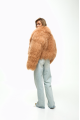 Caramel-colored women's sheepskin coat made of natural llama