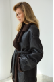 Women's sheepskin coat of black color made of natural sheepskin in VINTAGE style