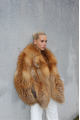 Stylish women's red fox fur coat