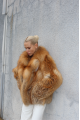 Stylish women's red fox fur coat
