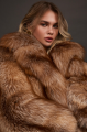Stylish brown fox fur coat