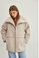 Women's sheepskin coat of beige color made of natural sheepskin