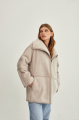 Women's sheepskin coat of beige color made of natural sheepskin