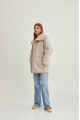 Women's sheepskin coat of beige color made of natural sheepskin