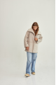 Women's sheepskin coat of beige color made of natural sheepskin