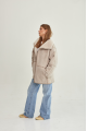 Women's sheepskin coat of beige color made of natural sheepskin