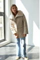 Women's sheepskin coat of beige color made of natural sheepskin