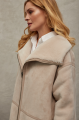 Women's sheepskin coat of beige color made of natural sheepskin