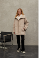 Women's sheepskin coat of beige color made of natural sheepskin