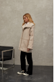 Women's sheepskin coat of beige color made of natural sheepskin