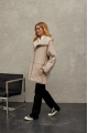 Women's sheepskin coat of beige color made of natural sheepskin