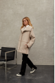 Women's sheepskin coat of beige color made of natural sheepskin